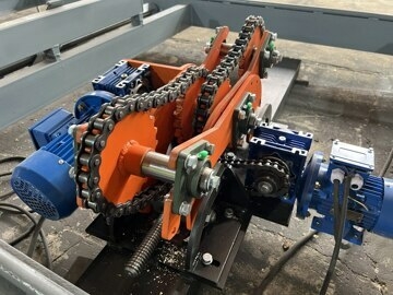 Цепной кантователь бревна